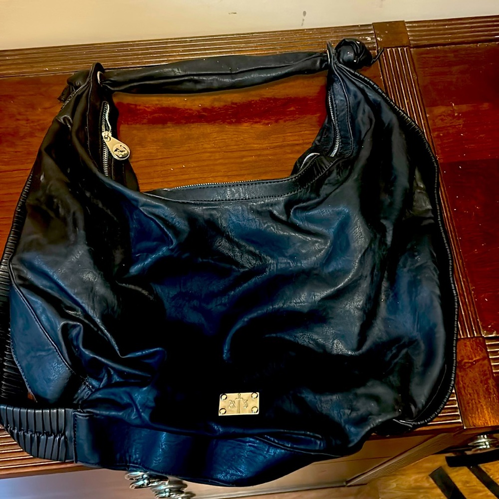 A big black R/J purse in great shape about 18 inches across and 15 inches tall